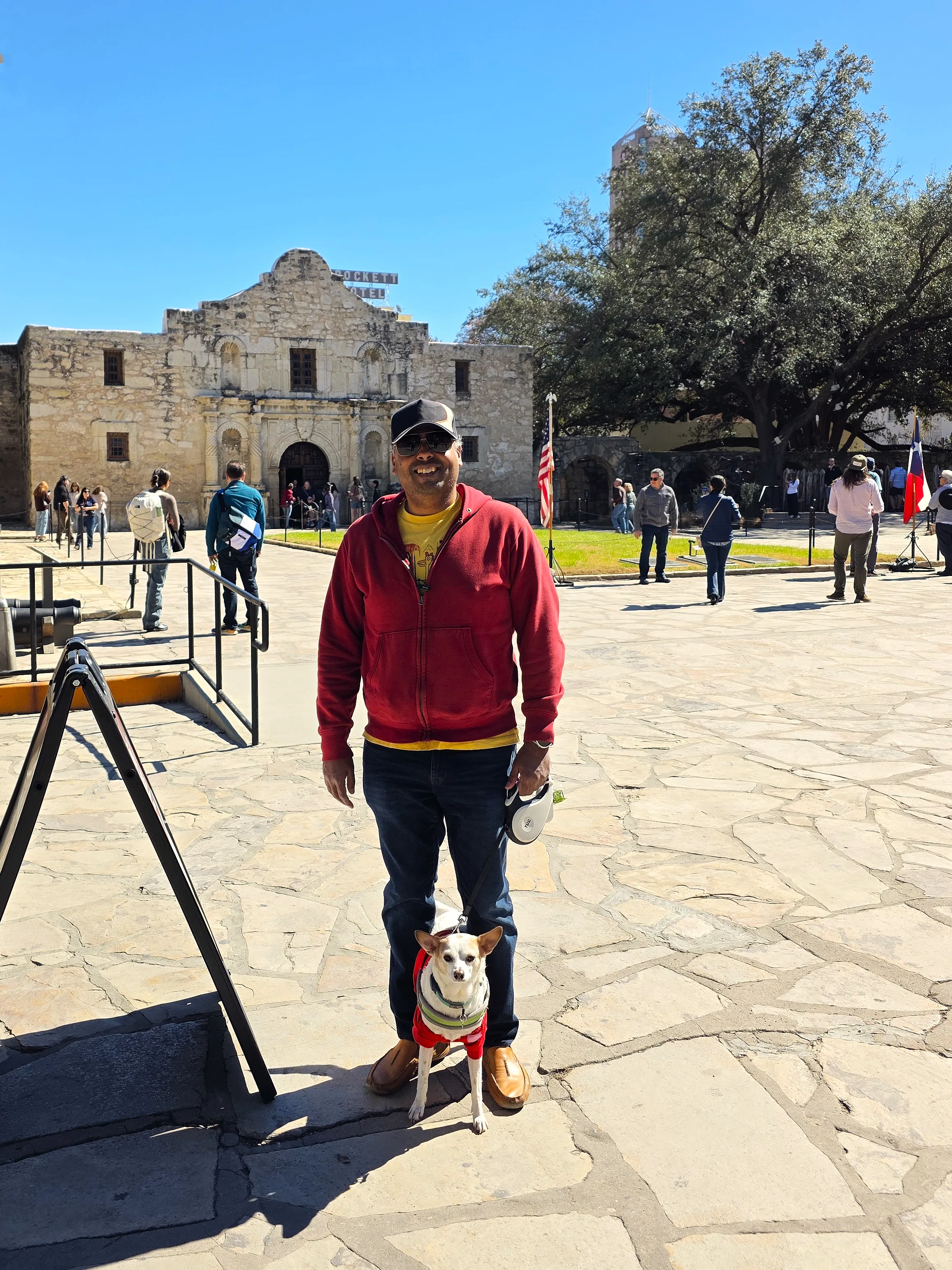Standing with Milo in the Alamo courtyard