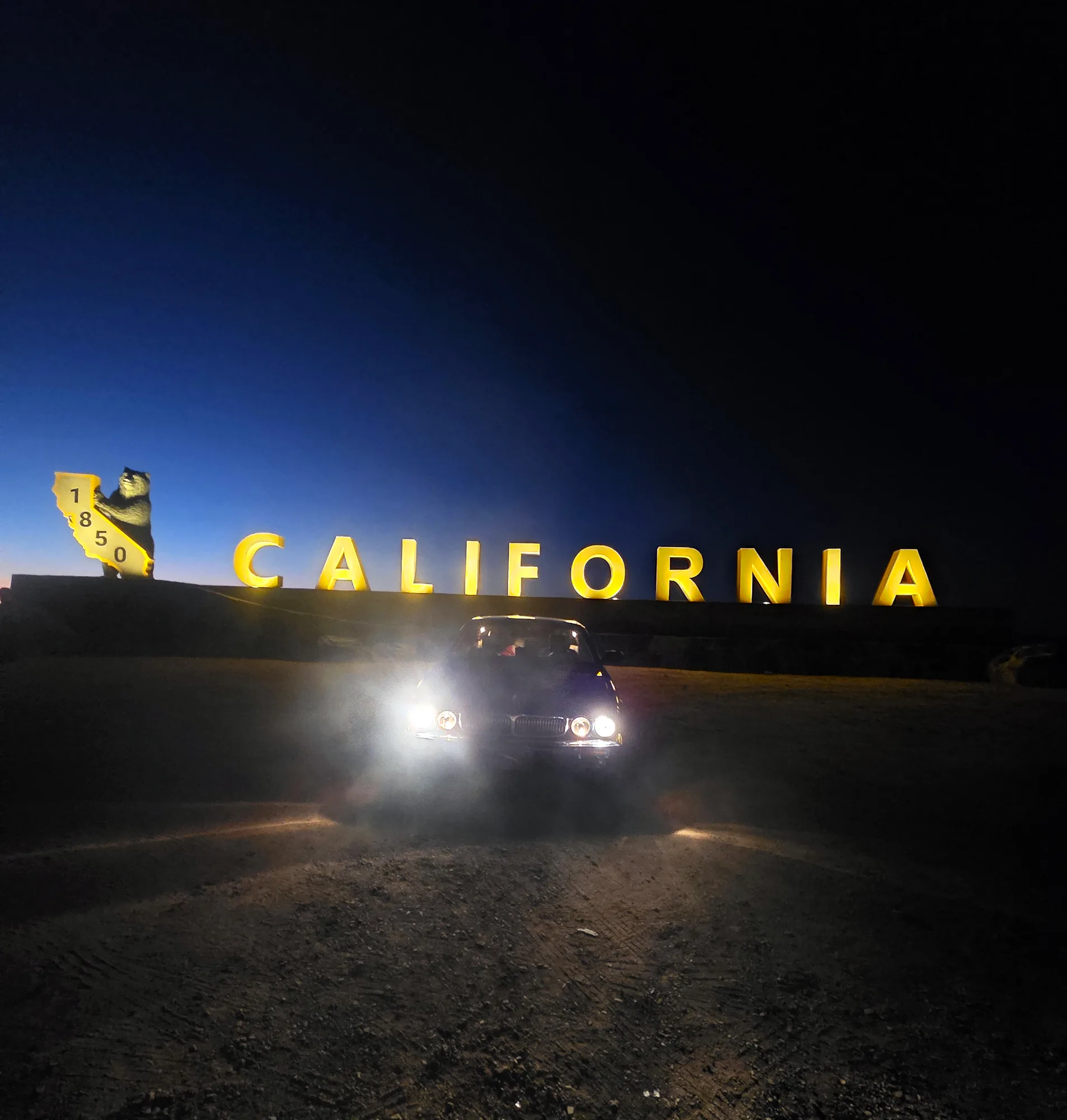 Jaguar X308 at the California state line at night